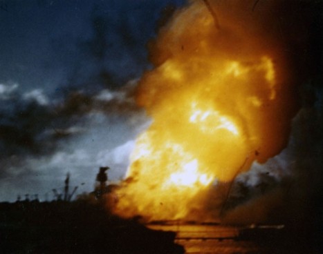 USS Arizona (BB-39) ablaze, immediately following the explosion of her forward magazines, Dec. 7, 1941. Frame clipped from a color motion picture taken from on board USS Solace (AH-5). Official U.S. Navy photograph, National Archives. 